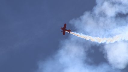 A plane flies through the air at Apple Valley Airport Airshow.